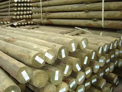 Stacked wooden logs with labels