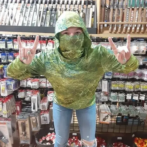 Shopper showing hand gestures in retail aisle