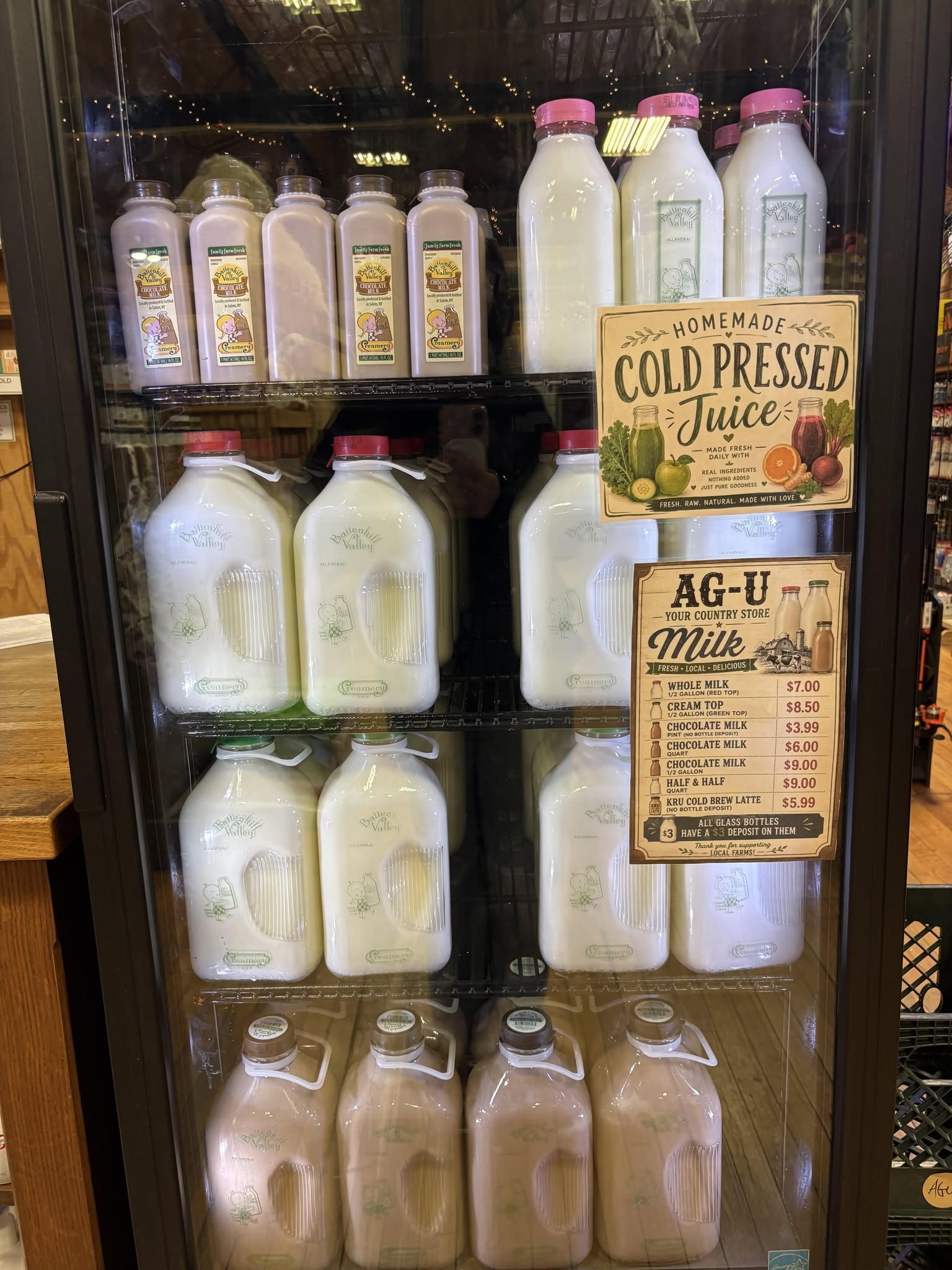 Refrigerated display of milk jugs