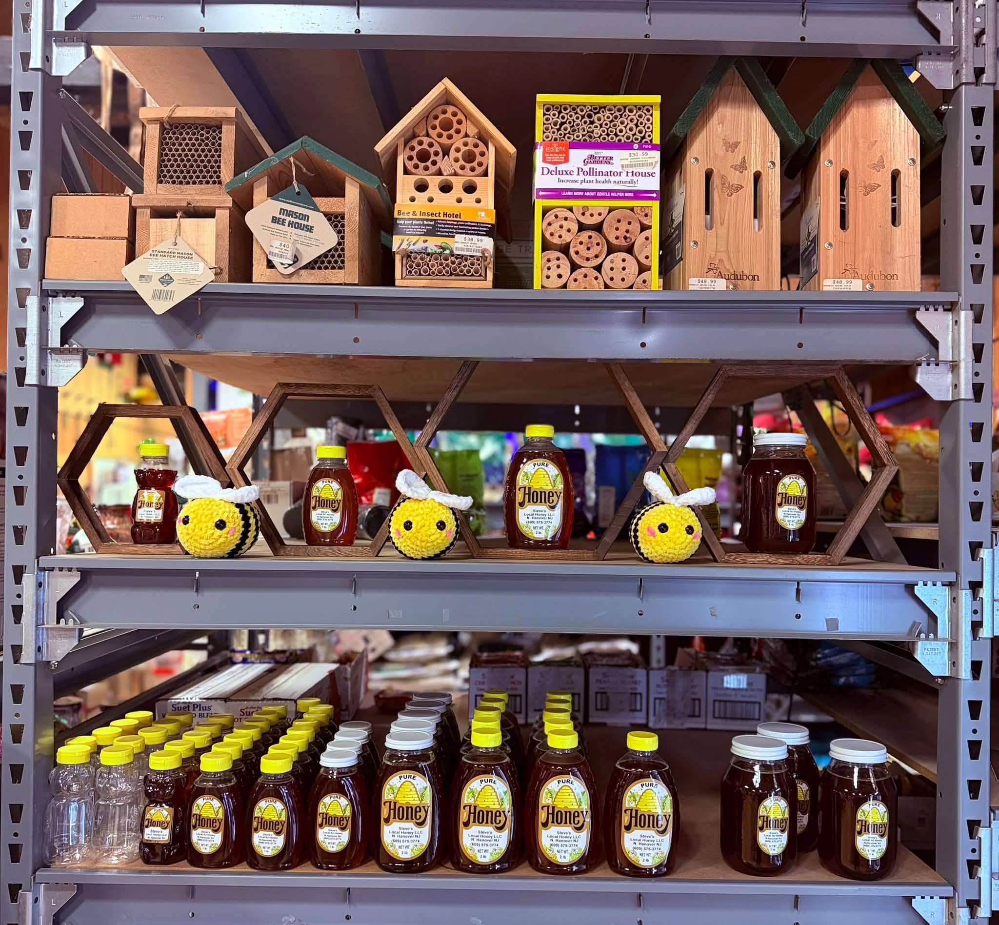 Honey jars and wooden bee houses display
